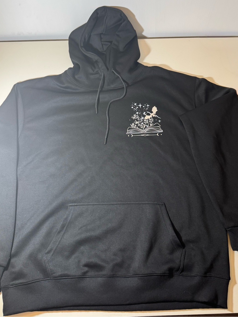 Black Hoodie with Gold Accents, “A Book A Day, keeps reality away”